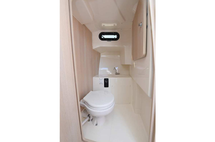 Enclosed Sea toilet, Sink with Tap and Opening Portlight